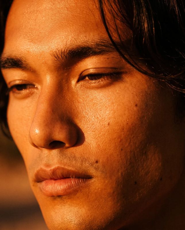AI-directed web creative, close-up portrait in warm light